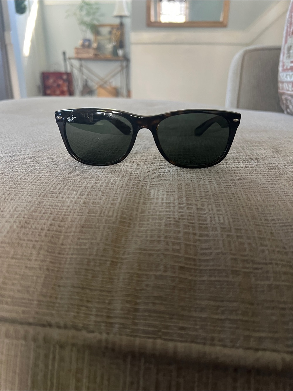 Ray-Ban 2132 58 mm New Wayfarer Frame Sunglasses with darkLenses.